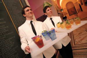 Smiley waiters at client event