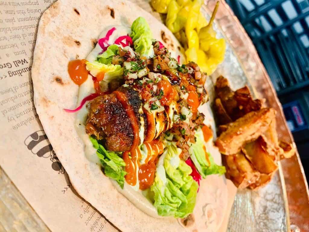 Open lamb Adana kebab with fresh flatbread & Jerusalem artichoke chips -