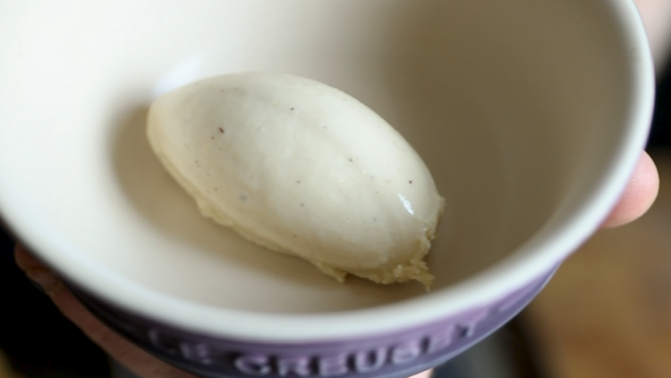 A scoop of brandy butter ice cream in a bowl