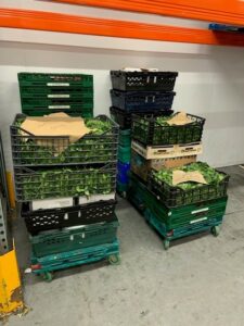 Crates filled with surplus food at The Felix Project